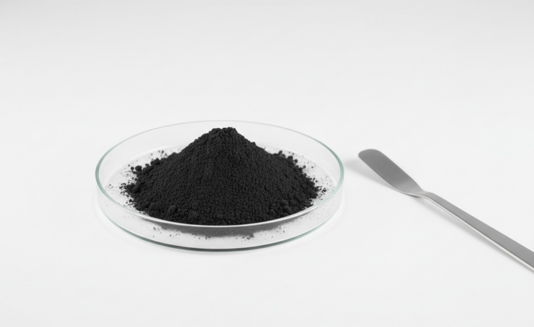 High-purity mesoporous carbon powder in a glass dish.