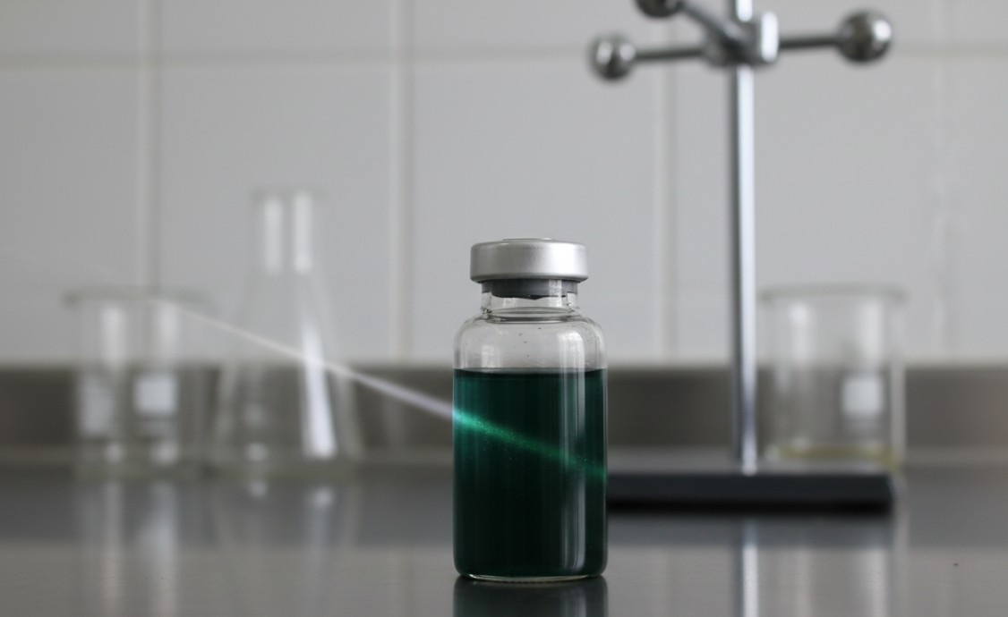 Dark green colloidal dispersion of MXene nanosheets showing Tyndall effect